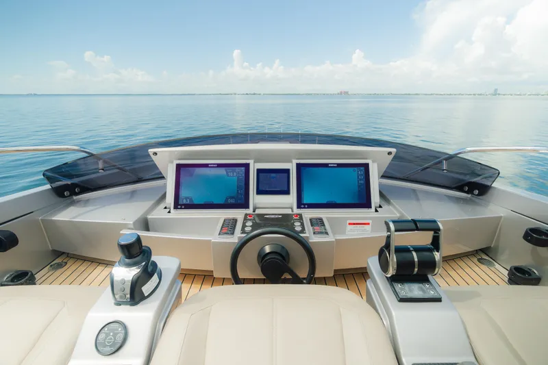 Nova Yacht Photos Pics Cockpit view of 2021 Pershing 8X yacht with modern navigation screens and controls.