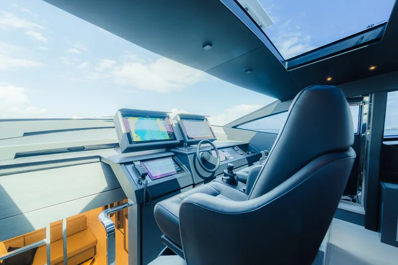 Nova Yacht Photos Pics Helm of 2021 Pershing 8X yacht with advanced navigation systems and luxurious seating.