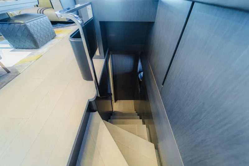 Nova Yacht Photos Pics Staircase inside 2021 Pershing 8X yacht, featuring modern design and sleek finishes.