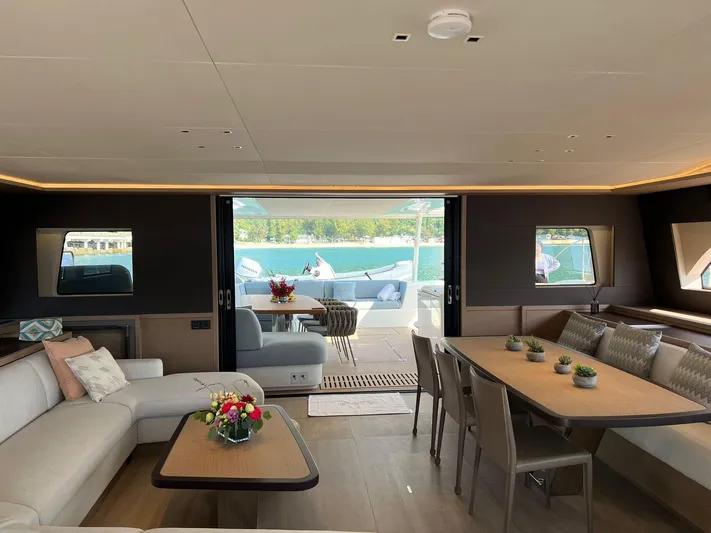  Yacht Photos Pics Luxurious interior of 2023 Lagoon SIXTY 7 yacht with elegant seating and dining area.