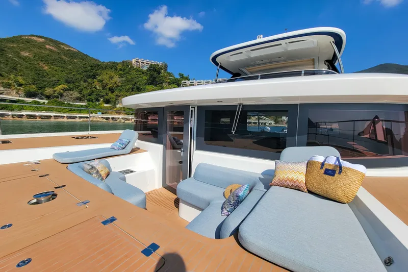  Yacht Photos Pics Luxurious 2023 Lagoon SIXTY 7 yacht with spacious deck and comfortable seating.