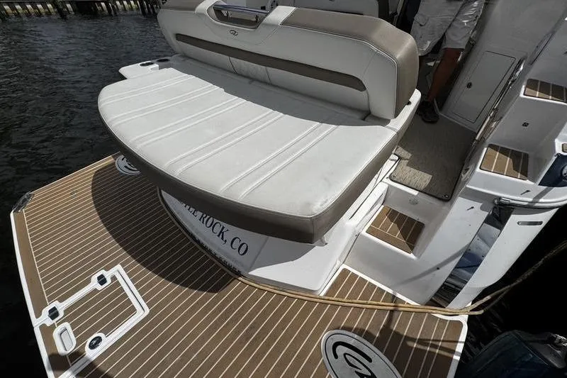  Yacht Photos Pics 2018 Regal 35 Sport Coupe boat with cushioned seating and teak-style deck.