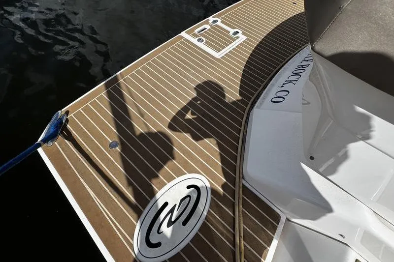  Yacht Photos Pics 2018 Regal 35 Sport Coupe boat deck with shadows and logo.