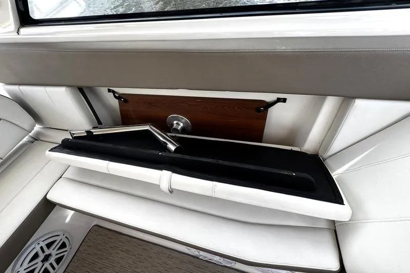  Yacht Photos Pics 2018 Regal 35 Sport Coupe interior with foldable seating and storage compartment.
