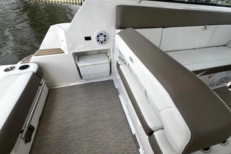  Yacht Photos Pics 2018 Regal 35 Sport Coupe interior with cushioned seating and built-in storage.