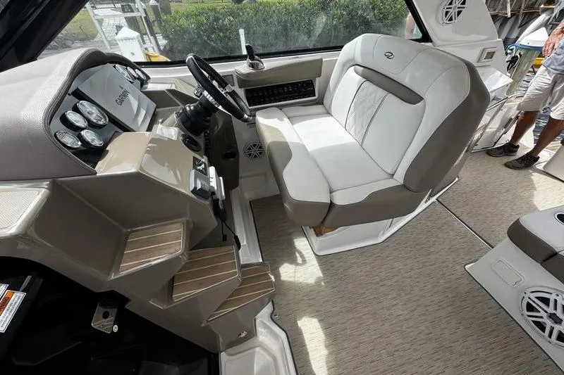  Yacht Photos Pics 2018 Regal 35 Sport Coupe helm with beige seating and modern dashboard controls.