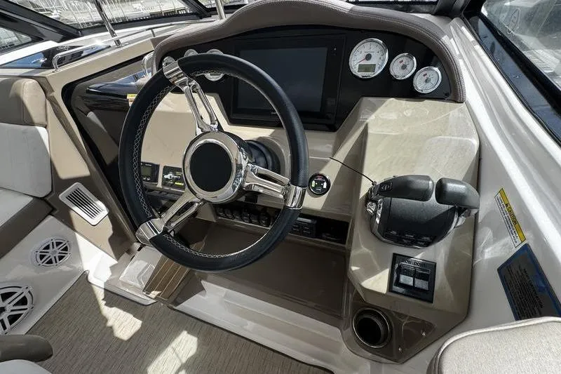  Yacht Photos Pics 2018 Regal 35 Sport Coupe dashboard with steering wheel and control panel.