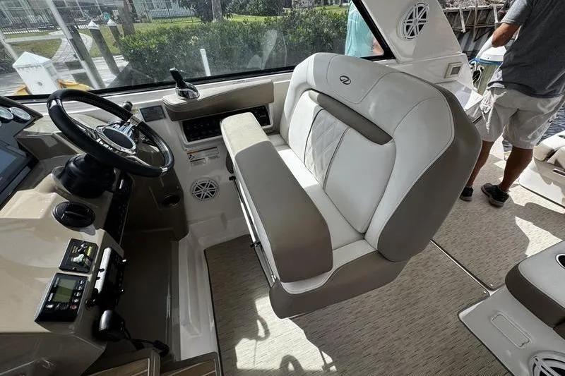  Yacht Photos Pics Interior of 2018 Regal 35 Sport Coupe boat with steering wheel and seating.