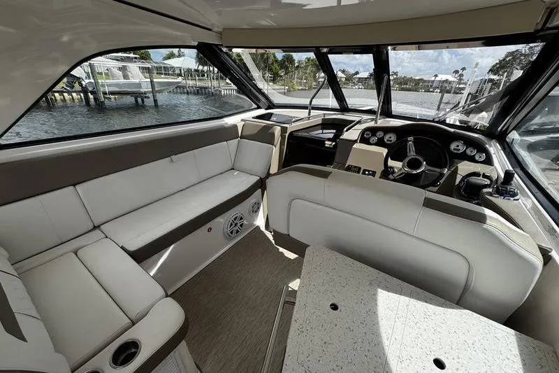  Yacht Photos Pics Interior of 2018 Regal 35 Sport Coupe yacht with luxurious seating and helm.