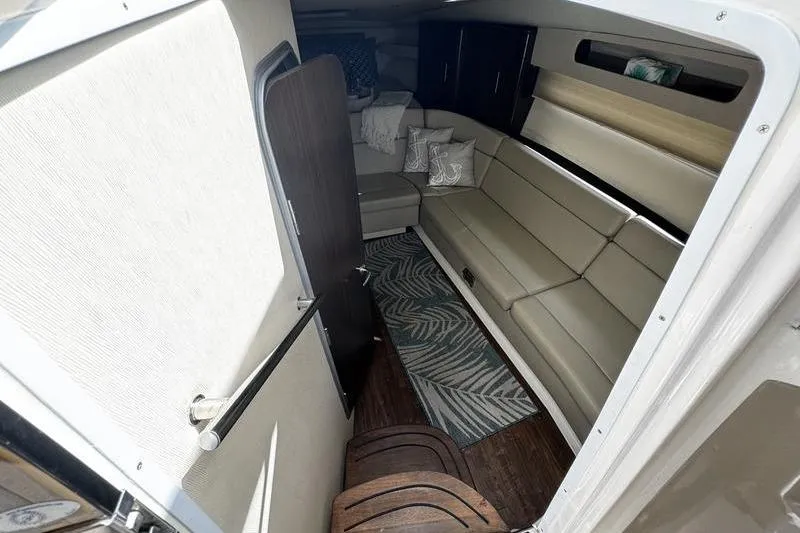  Yacht Photos Pics 2018 Regal 35 Sport Coupe interior with beige seating and modern decor.