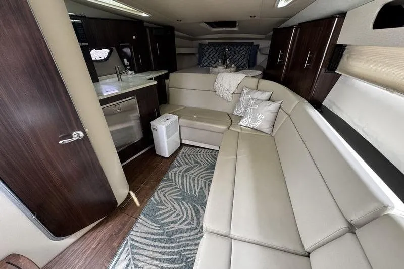  Yacht Photos Pics Luxurious interior of 2018 Regal 35 Sport Coupe with modern furnishings and kitchenette.