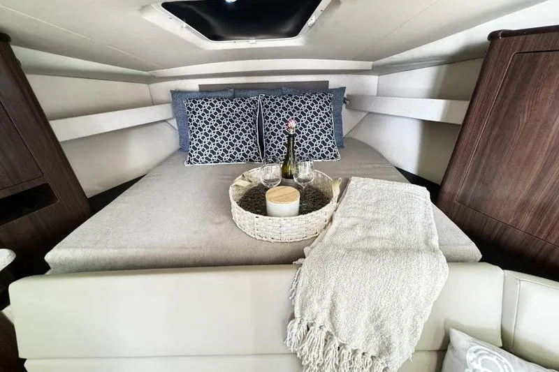  Yacht Photos Pics Luxurious cabin interior of 2018 Regal 35 Sport Coupe with cozy bedding and decor.