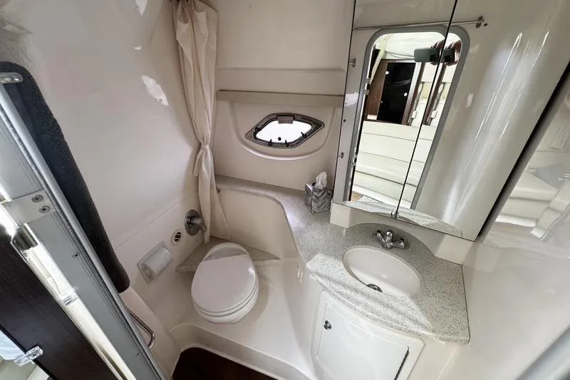  Yacht Photos Pics Bathroom interior of 2018 Regal 35 Sport Coupe with sink, toilet, and mirror.