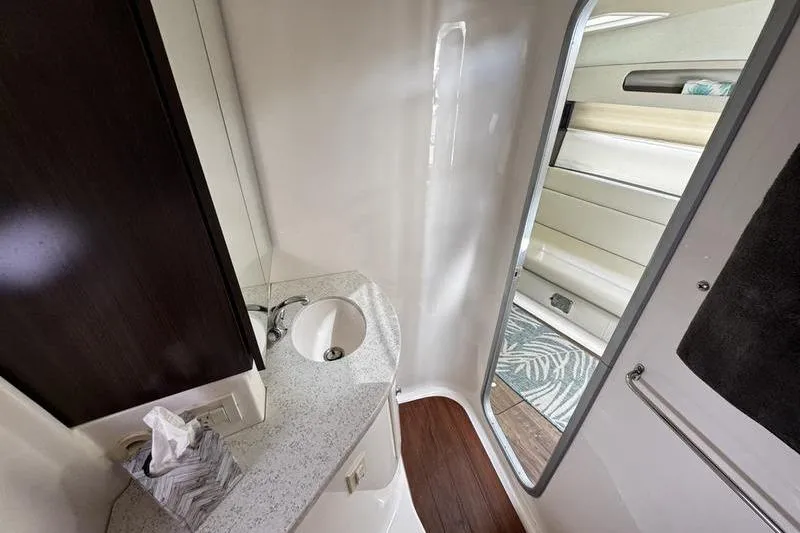  Yacht Photos Pics 2018 Regal 35 Sport Coupe bathroom interior with modern sink and sleek design.