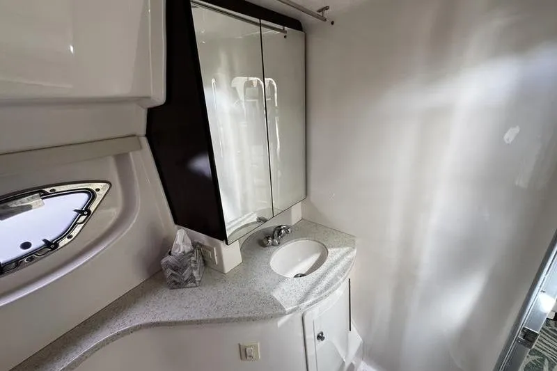  Yacht Photos Pics 2018 Regal 35 Sport Coupe bathroom with modern sink and mirrored cabinet.