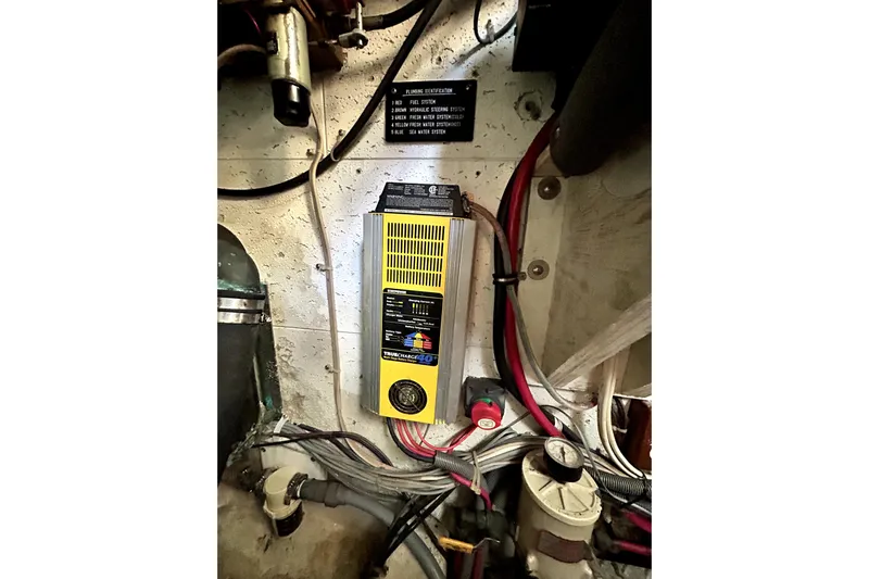 Chrysalis Yacht Photos Pics Engine room of 1989 Ocean Alexander 44 CPMY with electrical components and wiring.