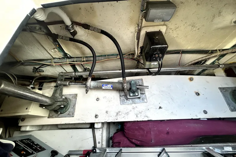 Chrysalis Yacht Photos Pics Engine room of 1989 Ocean Alexander 44 CPMY with visible mechanical components and wiring.