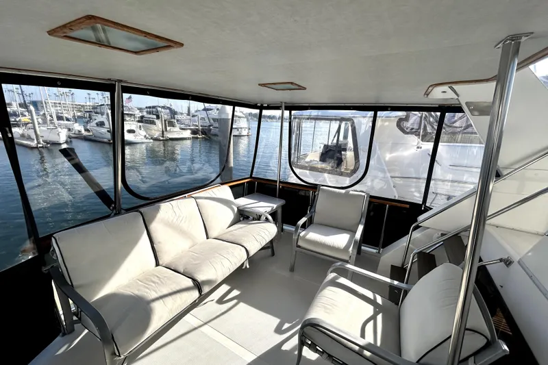 Chrysalis Yacht Photos Pics Spacious interior of 1989 Ocean Alexander 44 CPMY yacht with marina view.