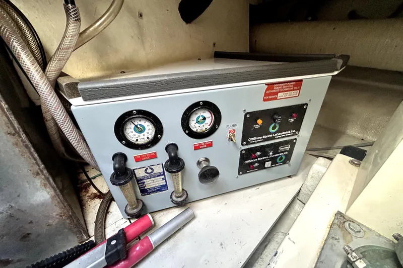 Chrysalis Yacht Photos Pics Control panel in 1989 Ocean Alexander 44 CPMY yacht engine room, featuring gauges and switches.