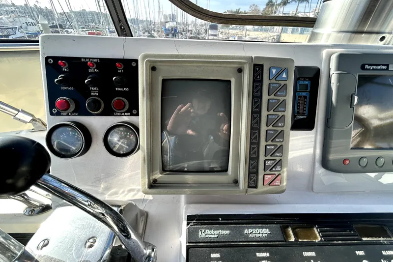 Chrysalis Yacht Photos Pics Control panel of a 1989 Ocean Alexander 44 CPMY yacht with navigation instruments.