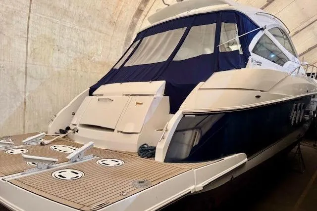  Yacht Photos Pics 2013 Cruisers Yachts 540 Sports Coupe in storage, rear view with covered deck.