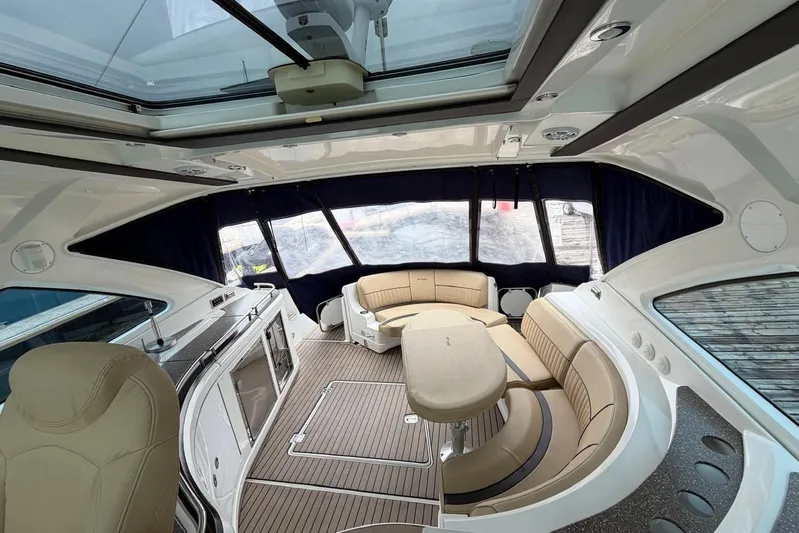  Yacht Photos Pics Luxurious interior of 2013 Cruisers Yachts 540 Sports Coupe with elegant seating and modern amenities.