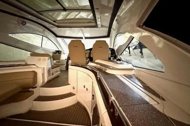  Yacht Photos Pics Interior of 2013 Cruisers Yachts 540 Sports Coupe, featuring luxurious seating and modern design.