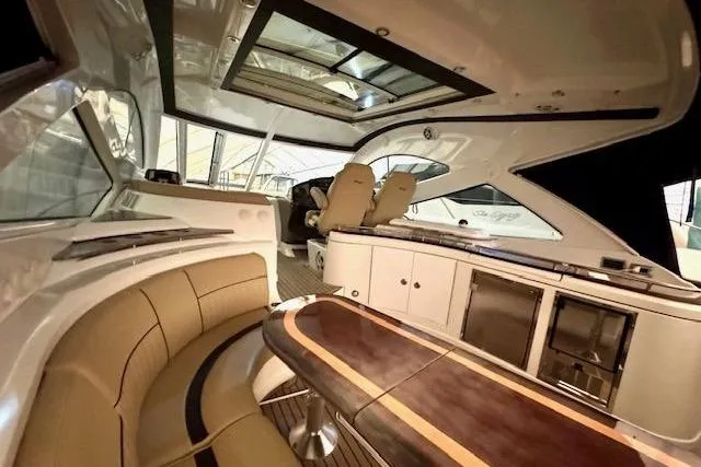  Yacht Photos Pics Luxurious interior of 2013 Cruisers Yachts 540 Sports Coupe with elegant seating and modern amenities.