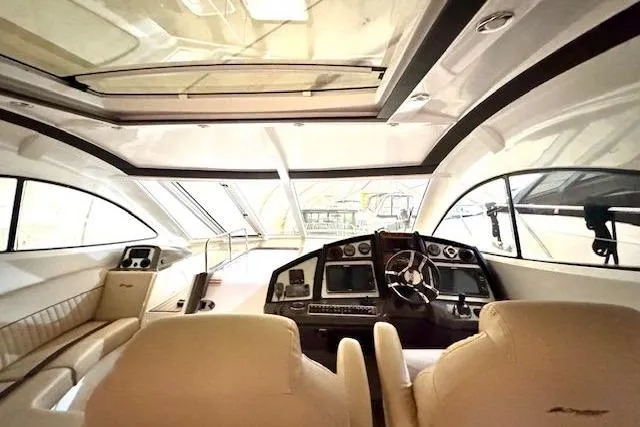  Yacht Photos Pics Interior of 2013 Cruisers Yachts 540 Sports Coupe with luxurious helm and seating.