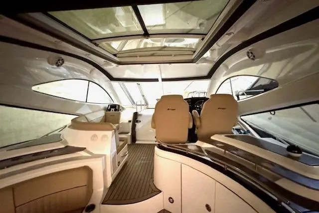  Yacht Photos Pics Interior of 2013 Cruisers Yachts 540 Sports Coupe with luxurious seating and panoramic windows.