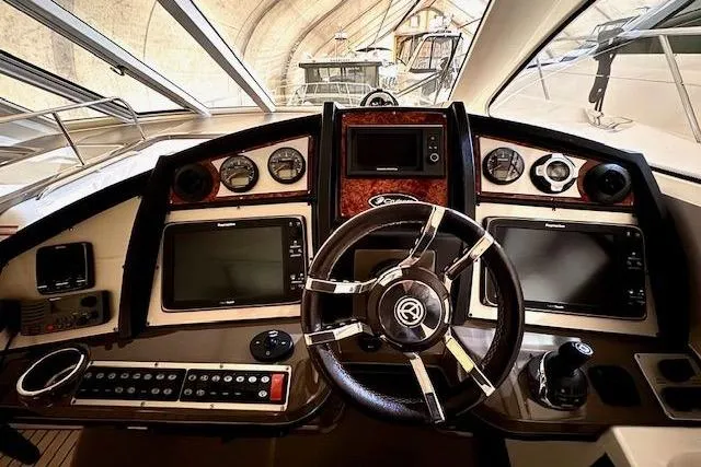  Yacht Photos Pics 2013 Cruisers Yachts 540 Sports Coupe helm with advanced navigation controls and sleek design.