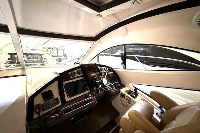  Yacht Photos Pics Interior cockpit of 2013 Cruisers Yachts 540 Sports Coupe, featuring modern navigation equipment.