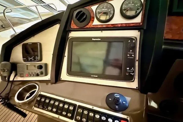  Yacht Photos Pics Dashboard of 2013 Cruisers Yachts 540 Sports Coupe with navigation and control instruments.