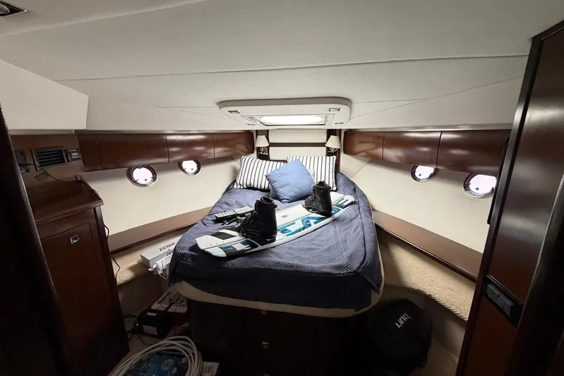  Yacht Photos Pics Luxurious cabin interior of 2013 Cruisers Yachts 540 Sports Coupe with bed and wakeboard.