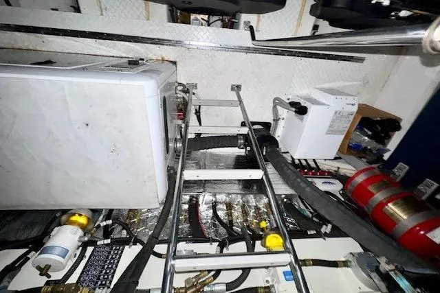  Yacht Photos Pics Engine room of 2013 Cruisers Yachts 540 Sports Coupe with equipment and ladder.