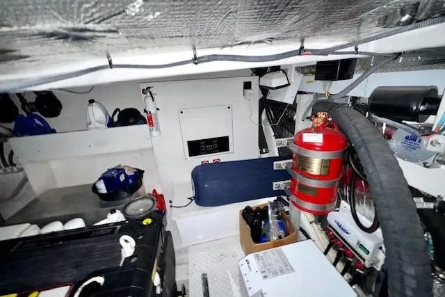  Yacht Photos Pics Engine room of 2013 Cruisers Yachts 540 Sports Coupe with equipment and storage.