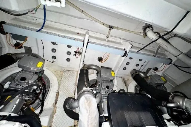  Yacht Photos Pics Engine room of 2013 Cruisers Yachts 540 Sports Coupe with visible machinery and wiring.