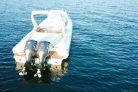 2017 Capelli Tempest 40 boat with dual engines on calm water.