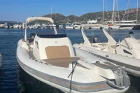 2017 Capelli Tempest 40 boat docked in a marina, surrounded by other vessels.