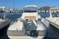 2017 Capelli Tempest 40 boat docked in a marina under clear blue skies.