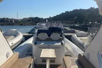 2017 Capelli Tempest 40 boat interior with seating, docked in a sunny marina.