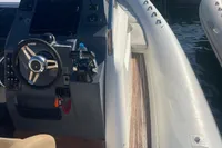 2017 Capelli Tempest 40 boat interior with steering wheel and dashboard at marina.