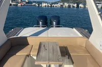 2017 Capelli Tempest 40 boat interior with seating and table, docked in a marina.