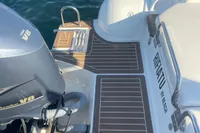 2017 Capelli Tempest 40 boat with Yamaha V8 engine, docked on calm water.