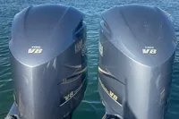 Twin Yamaha V8 outboard engines on a 2017 Capelli Tempest 40, docked in a marina.