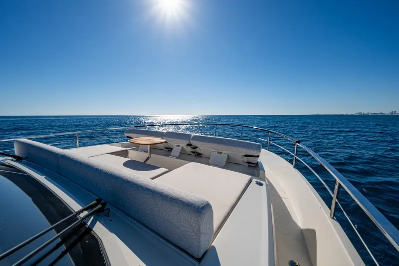 Alamar Yacht Photos Pics 2023 Astondoa AS5 yacht deck with sun loungers on open sea.