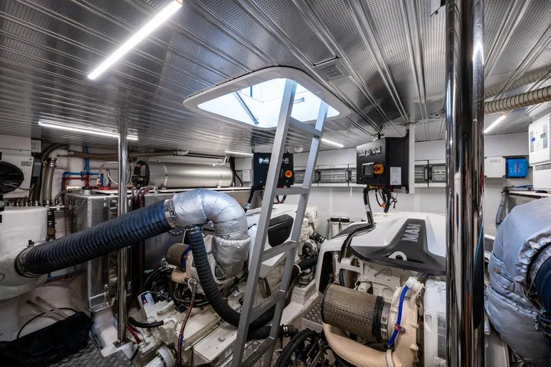 Alamar Yacht Photos Pics Engine room of 2023 Astondoa AS5 yacht with modern equipment and machinery.