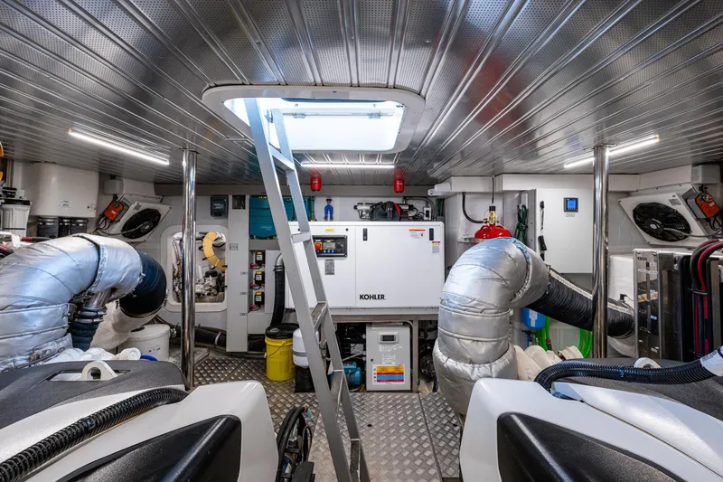 Alamar Yacht Photos Pics Engine room of 2023 Astondoa AS5 yacht with Kohler generator and metallic ductwork.