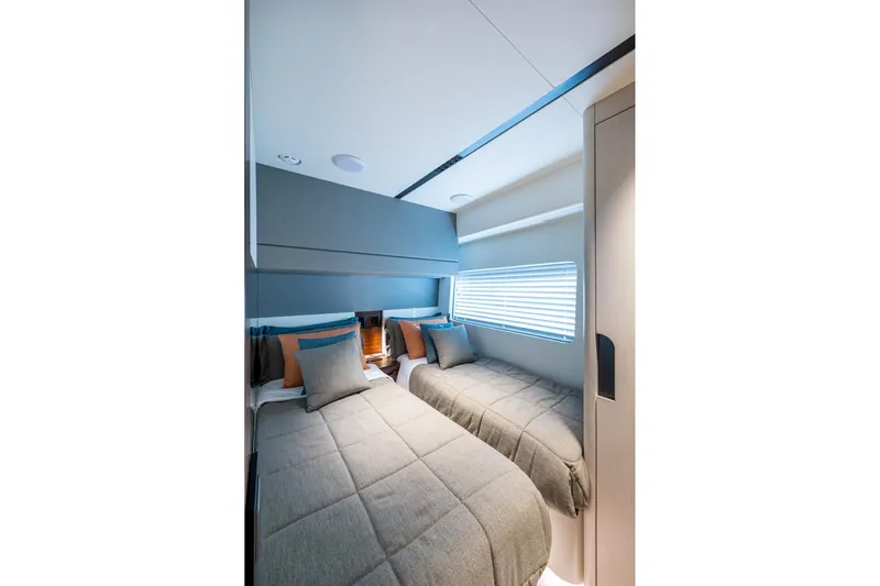 Alamar Yacht Photos Pics 2023 Astondoa AS5 yacht cabin with twin beds and modern decor.