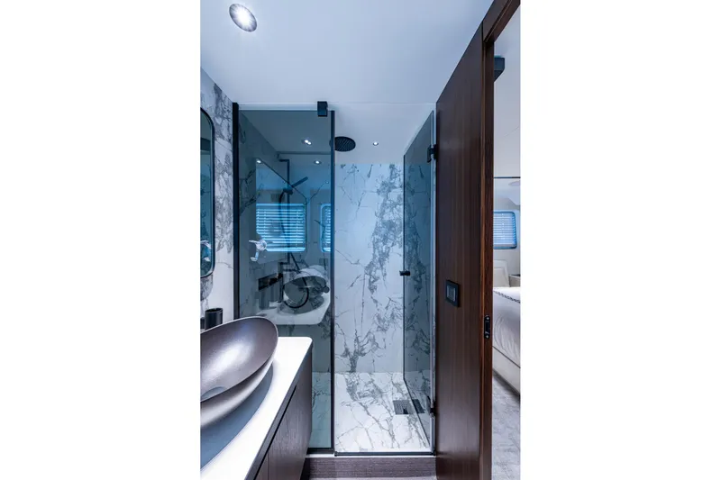 Alamar Yacht Photos Pics Luxurious 2023 Astondoa AS5 yacht bathroom with marble shower and modern fixtures.